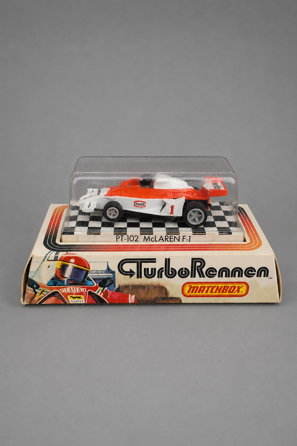Matchbox Turbo Rennen McLaren F-1 PT-102 – Slotcar rot/weiß mit Texaco-Startnummer 1 in originaler ungeöffneter Präsentationsbox, 1978