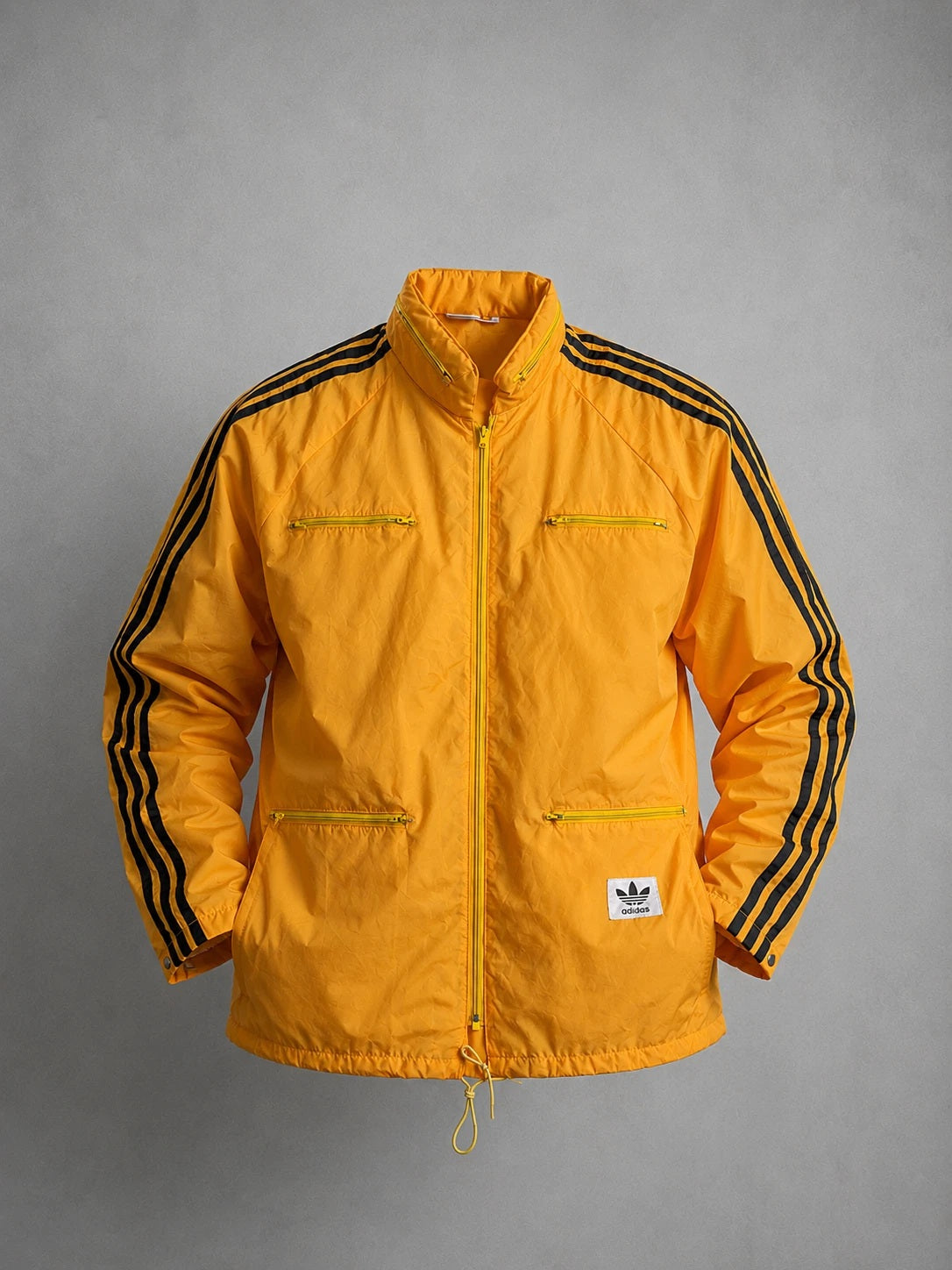 Vintage adidas Windbreaker Jacke 70er 80er Jahre – Gelb Orange mit schwarzen 3-Streifen – Größe L – Oldschool Retro Trainingsjacke